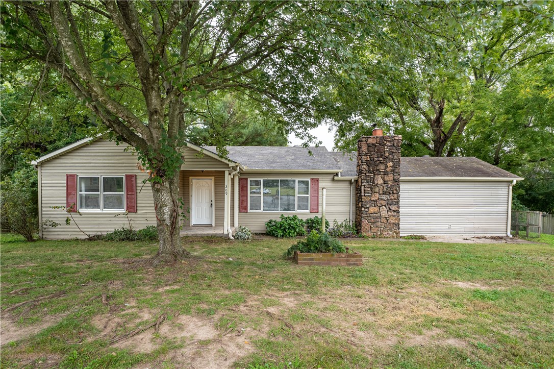 Welcome to this charming home in the heart of Elm Springs! Recently renovated, this property features new vinyl flooring and paint throughout, giving it a fresh and modern feel. With four bedrooms and two bathrooms, there is plenty of space for the whole family. The two living areas provide ample room for relaxation and entertaining. Cozy up by the wood stove during the colder months, and take advantage of the bonus room for additional flexibility. Situated on over half an acre, the large deck and backyard offers endless possibilities for outdoor activities.