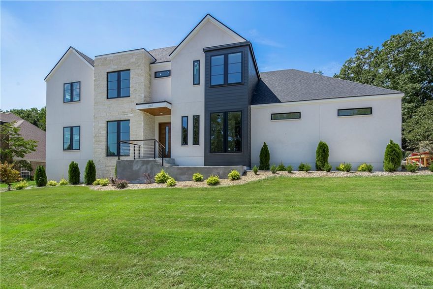 Modern elegance meets traditional design in this NEW CONSTRUCTION home by Dwellings. Nestled on almost ½ an acre within the highly coveted Heathrow subdivision in north Bentonville, this exceptional home seamlessly blends contemporary design with traditional charm. As you enter through the custom wood front door you’re greeted with soaring ceilings with an abundance of natural light. Custom cabinets & built-ins, hidden storage, well-thought-out design, and flow will instantly make you feel right at home. With too many details to list, including an in-ground pool w/ fountains, tanning ledge & heat pump, 3-car garage, home office, smart home technology & energy-efficient features, this is the perfect family home. The Razorback Greenway is right around the corner & all Bentonville has to offer is just right up the road. Don't miss this opportunity to own this exquisite RARE FIND! Schedule a showing today to experience the excellence of luxury living and make this dream home your reality! ATTACHED FEATURE SHEET.