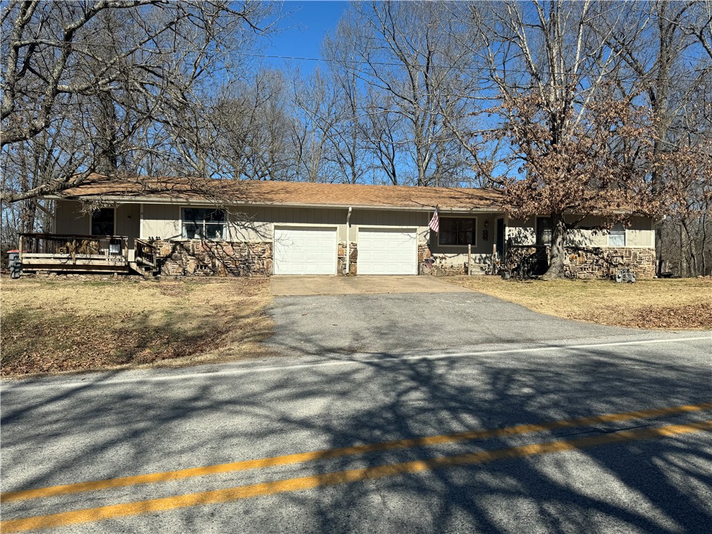 Fantastic investment property or to own and rent other side. Income from day one! always rented. Units have been remodeled, each unit consists of 2 bedrooms and 1 full bath with attached 1 car garage. Huge lot 1.22 acres. Close to downtown Rogers and Beaver Lake.