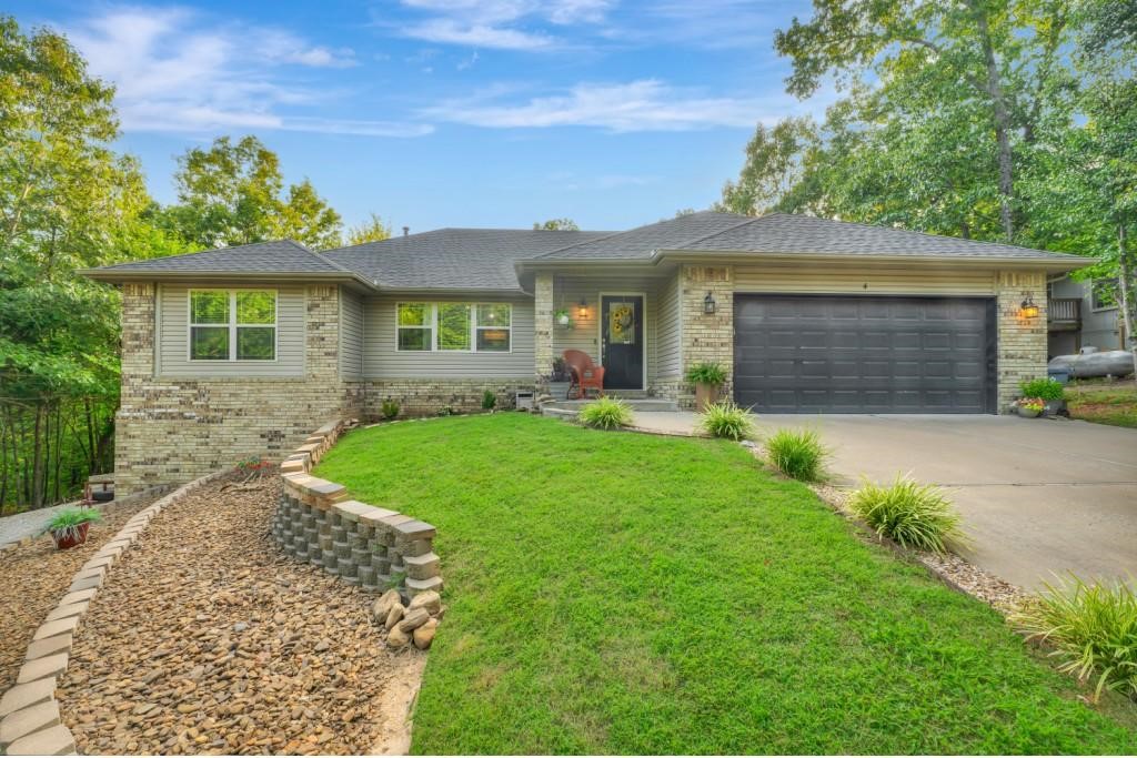 Discover the perfect blend of comfort, style, & convenience in this beautifully maintained single-family home. With 1,834 sq ft on the main level & an 570 more sq ft of finished walk-out lower level space, this home offers flexibility for modern living. The split-bedroom layout features 3 spacious bedrooms & 2 full baths, ideal for privacy & function. The living room invites you in with a warm gas-log fireplace, while the kitchen boasts granite countertops & gleaming hardwood floors - great for entertaining or everyday living. Step outside & enjoy a fully fenced backyard, attached 2-car garage, & a 2nd driveway providing easy access to the lower level. Whether you're hosting guests or need a separate workspace, the lower private entrance adds versatility. Nestled in a serene setting with wooded views, this home is just minutes from everything—shopping, dining, golf courses, fitness centers, & scenic mountain bike/walking trails. It’s a rare opportunity to enjoy nature & convenience in one stunning package.