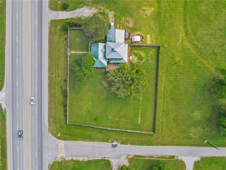 Incredible Investment Opportunity in the Heart of Tontitown!
Don’t miss this rare chance to own an almost 1-acre parcel with dual zoning (commercial and residential) perfectly positioned in Tontitown’s rapidly expanding development corridor. The property includes a 2,578 sq ft structure with existing utilities and excellent road frontage on W Henri De Tonti Blvd. Located directly across from a newly acquired 27-acre commercial site and less than one mile from the upcoming Hwy 612 extension, this site offers exceptional visibility and accessibility. It’s ideal for commercial redevelopment, live/work business use, or a long-term investment hold. With high daily traffic counts, growing nearby residential communities, and rising land values, this property represents a prime opportunity for investors and developers alike.