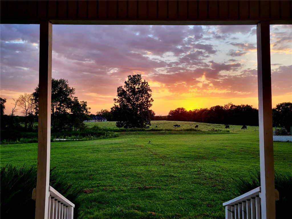 Just 7.5 miles from XNA Airport and 14.2 miles from the Walmart Home Office, this incredible 4-bed, 3.5-bath custom home on 20.12 acres offers 3,886 sq ft of exceptional living space. From the custom gated entrance to the nearly full wrap-around porch, youāll be captivated by breathtaking sunset views and the tranquility of the countryside. Inside, enjoy the warmth of a wood-burning stove and the convenience of a central vacuum system. The spacious pantry doubles as a storm shelter/panic room for peace of mind.
Step outside to entertain with ease, featuring a piped propane hookup, a custom firepit, and a serene stock pond. The property also includes a 1,920 sq ft insulated shop with a wood-burning stove and 50 Amp welder/generator hookup, plus a separate antique gambrel-style barn with hay loft for added charm and versatility.
This one-of-a-kind property blends comfort, utility, and country charm.
Property is also listed with just 9.12 acres. MLS #1306511