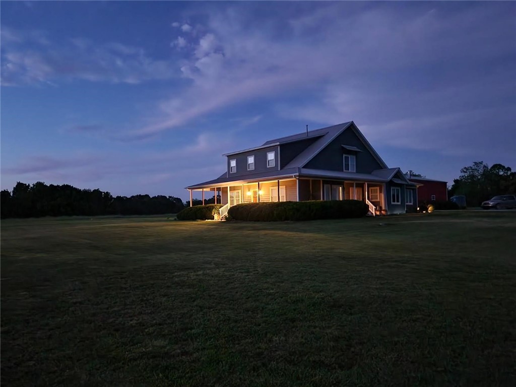 Just 7.5 miles from XNA Airport and 14.2 miles from the Walmart Home Office, this incredible 4-bed, 3.5-bath custom home on 20.12 acres offers 3,886 sq ft of exceptional living space. From the custom gated entrance to the nearly full wrap-around porch, you’ll be captivated by breathtaking sunset views and the tranquility of the countryside. Inside, enjoy the warmth of a wood-burning stove and the convenience of a central vacuum system. The spacious pantry doubles as a storm shelter/panic room for peace of mind.
Step outside to entertain with ease, featuring a piped propane hookup, a custom firepit, and a serene stock pond. The property also includes a 1,920 sq ft insulated shop with a wood-burning stove and 50 Amp welder/generator hookup, plus a separate antique gambrel-style barn with hay loft for added charm and versatility.
This one-of-a-kind property blends comfort, utility, and country charm.
Property is also listed with just 9.12 acres. MLS #1306511
