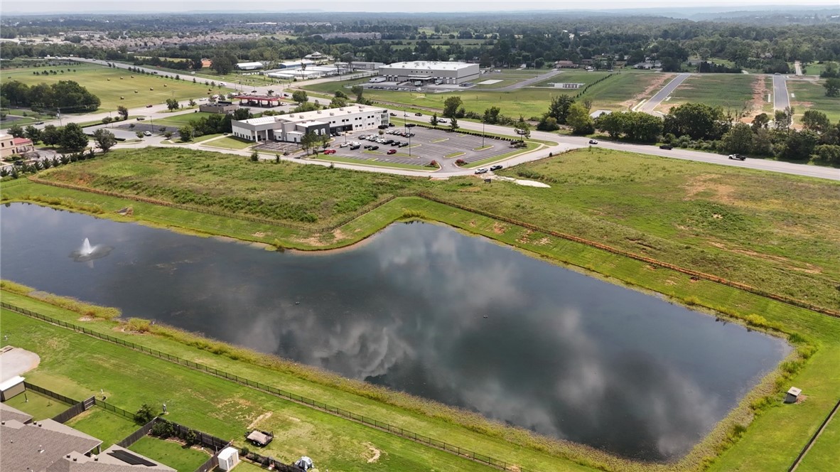 Wonderful opportunity to develop in this prime location just off of Pleasant Grove on the boarder of Rogers and Lowell in one of the fastest growing commercial areas. Located next to Fitness One with plenty of street frontage, utilities at the street, detention established to the west and ready for a multitude of possibilities. May also be purchased with lot 189 giving an additional 3.87 acres.