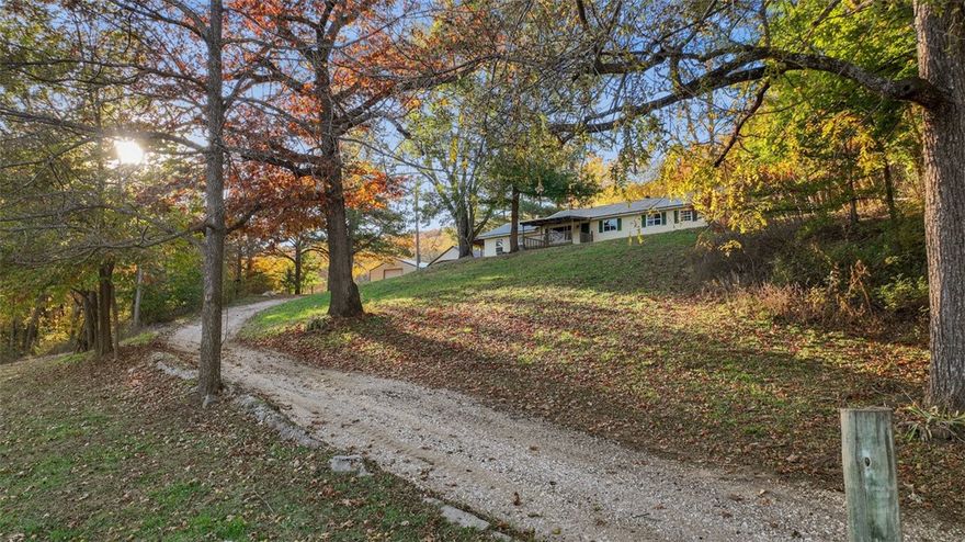 Welcome to 15731 Parker Branch Rd. This mature, landscaped property has a gentle, elevated approach to a three-bedroom, two-bathroom residence. You will observe a spacious, well-maintained driveway and an expansive carport next to a 30x40 insulated metal building. The large concrete patio beside the carport provides ample space for gatherings and is also suitable for an above-ground pool.
The home offers a welcoming atmosphere. Off the dining area, a covered patio/deck presents impressive views of the surrounding landscape. The main bedroom includes additional floor support under the safe; the safe is available for purchase separately after closing, if desired by the buyer. All personal property, safe if applicable and farm equipment, will be removed prior to closing.  New approved survey in attachments.
A potbelly pig named Sir Eats Alot currently resides in the back pond pasture and may convey with the property if preferred.  Please keep gates closed.