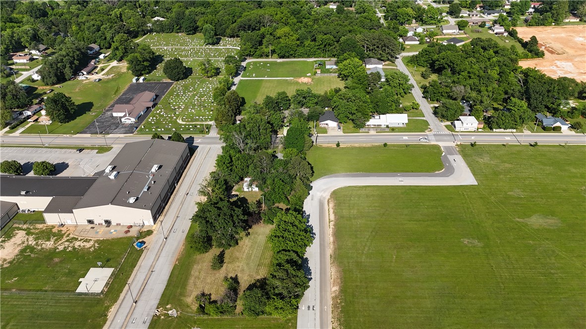 1.01 Acres of Beautiful flat land on high traffic road. This piece of property would be perfect to be rezoned as Administrative or Commercial property!! All utilities already on site. Surrounded by High traffic administrative land already. This road has also become a throughfare from highway 72 to highway 94 in Pea Ridge.