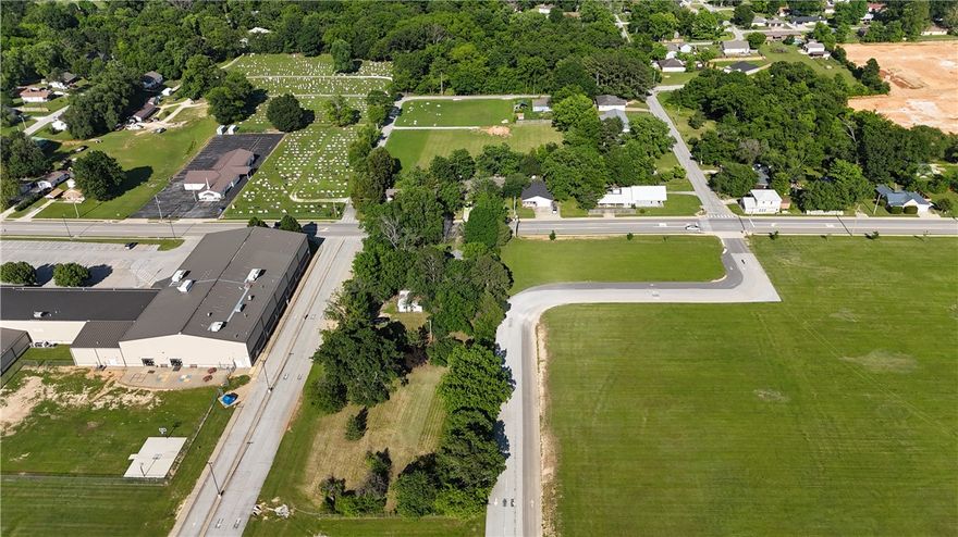 1.01 Acres of Beautiful flat land on high traffic road. This piece of property would be perfect to be rezoned as Administrative or Commercial property!! All utilities already on site. Surrounded by High traffic administrative land already. This road has also become a throughfare from highway 72 to highway 94 in Pea Ridge.