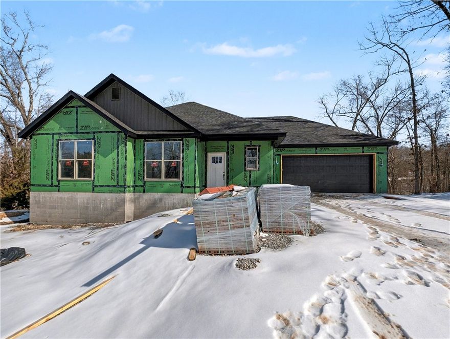 Welcome To Your Next Home! This Brand-New Build Packs Style, Space, And That “Let’s Make Life Easy” Energy. Bentonville Schools. Sitting In A Killer Spot With Mountain Bike Trails Close By, You’re Set Up For Instant Adventure And Everyday Convenience. Step Into A Bright, Airy Layout Featuring A Vaulted Living Room, Bold Beam Accents, A Warm Fireplace, And A Kitchen That Shows Off—Custom Cabinets, Quartz Counters, Tile Backsplash, Island Seating, And A Walk-In Pantry Ready For All The Snacks. The Primary Suite Brings The Retreat Vibes With A Full Custom Tile Shower, Dual Vanity, And A Closet Built For Real-Life Storage Wins. 2 Secondary Bedrooms Give You Options. Full Hall Bath. Head Out Back To A Covered Deck That Looks Over A Calm, Wooded Backyard—Perfect For Coffee, Chill Time, Or Post-Ride Recovery. Thoughtful Upgrades, A Smart Floorplan, And A Location That Just Works. This One Feels Good The Second You Walk In! Still Time To Make Interior Selections.