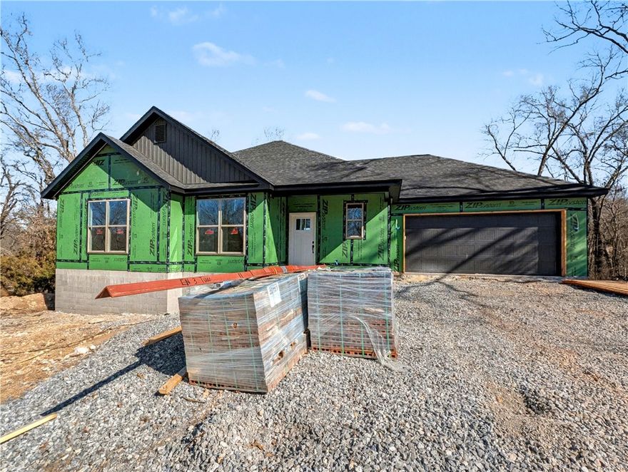Welcome To Your Next Home! This Brand-New Build Packs Style, Space, And That “Let’s Make Life Easy” Energy. Bentonville Schools. Sitting In A Killer Spot With Mountain Bike Trails Close By, You’re Set Up For Instant Adventure And Everyday Convenience. Step Into A Bright, Airy Layout Featuring A Vaulted Living Room, Bold Beam Accents, A Warm Fireplace, And A Kitchen That Shows Off—Custom Cabinets, Quartz Counters, Tile Backsplash, Island Seating, And A Walk-In Pantry Ready For All The Snacks. The Primary Suite Brings The Retreat Vibes With A Full Custom Tile Shower, Dual Vanity, And A Closet Built For Real-Life Storage Wins. 2 Secondary Bedrooms Give You Options. Full Hall Bath. Head Out Back To A Covered Deck That Looks Over A Calm, Wooded Backyard—Perfect For Coffee, Chill Time, Or Post-Ride Recovery. Thoughtful Upgrades, A Smart Floorplan, And A Location That Just Works. This One Feels Good The Second You Walk In! Still Time To Make Interior Selections.