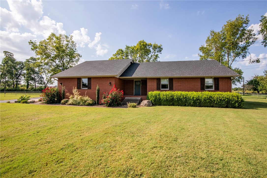 Beautiful home with large lot on cul-de-sac just minutes from trails, parks and Downtown Bentonville. 3 bedrooms and 2 and 1/2 bath. Hardwood flooring through main living area and carpet in the bedrooms. Open living area, living room with vaulted ceiling with access to a large back deck and fenced yard. Kitchen features stainless appliances and granite counters. Primary bedroom has double closets and large walk in shower. 2 car oversized garage and additional storage shed. Owner will maintain lawncare for additional fee.