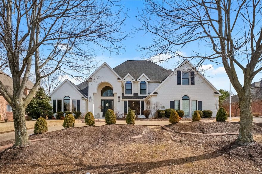 Located in gated Pinnacle Country Club, this 4,424 sq ft transitional home sits on a private half-acre lot & is fully renovated & move-in ready. The main level includes formal dining, living room, eat-in kitchen with adjoining family room, office with fireplace &  primary suite with fireplace. The renovated primary bathroom features dual sinks, soaking tub, large walk-in shower & dual walk-in closets. Upstairs includes 3 bedrooms, 2 full bathrooms, bonus room & newly added game room. Recent updates include new countertops throughout, full interior and exterior paint, updated lighting, roller screen in office, new windows, new exterior lighting, extended patio with outdoor fireplace + retractable screens & a backyard perimeter mosquito misting system. Outdoor living overlooks a private backyard with pool & spillover waterfalls. Rare 5 car garage, circle drive, whole-house generator, whole-house air & water filtration & storm shelter in garage. Convenient to I-49, Walmart AMP, hospitals, shopping, dining, and trails.