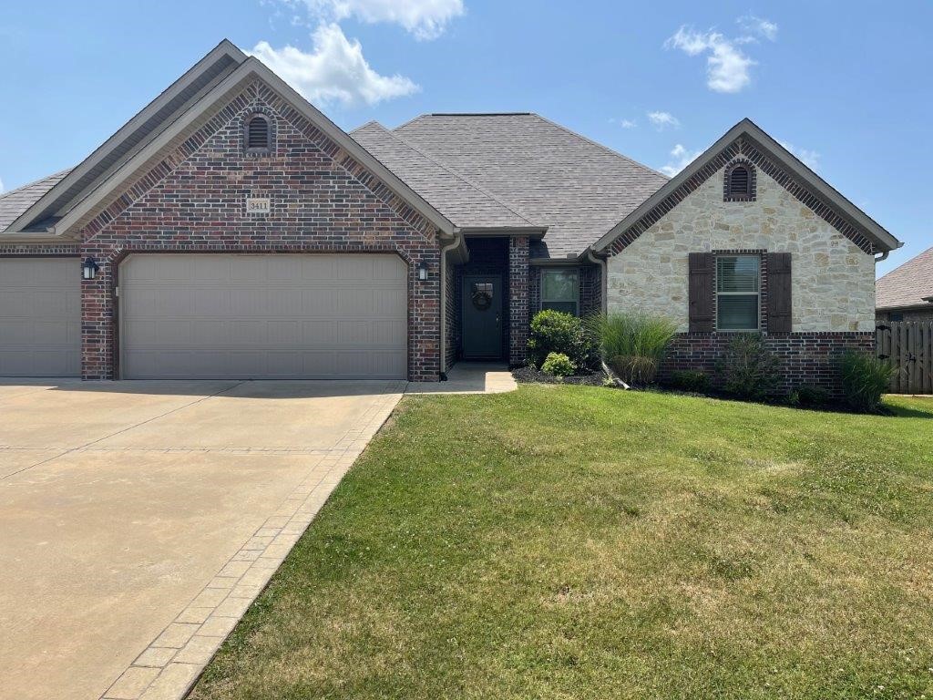 Prime location just minutes to WM and Downtown Bentonville! Open floor plan with large fenced in backyard. Covered back patio excellent for entertainment. Brand new roof - 2021. No carpet at all! Vaulted ceilings in living room, along with gas fireplace. Mud room and 3 car garage. Close to schools. Will go fast; call for appointment today!