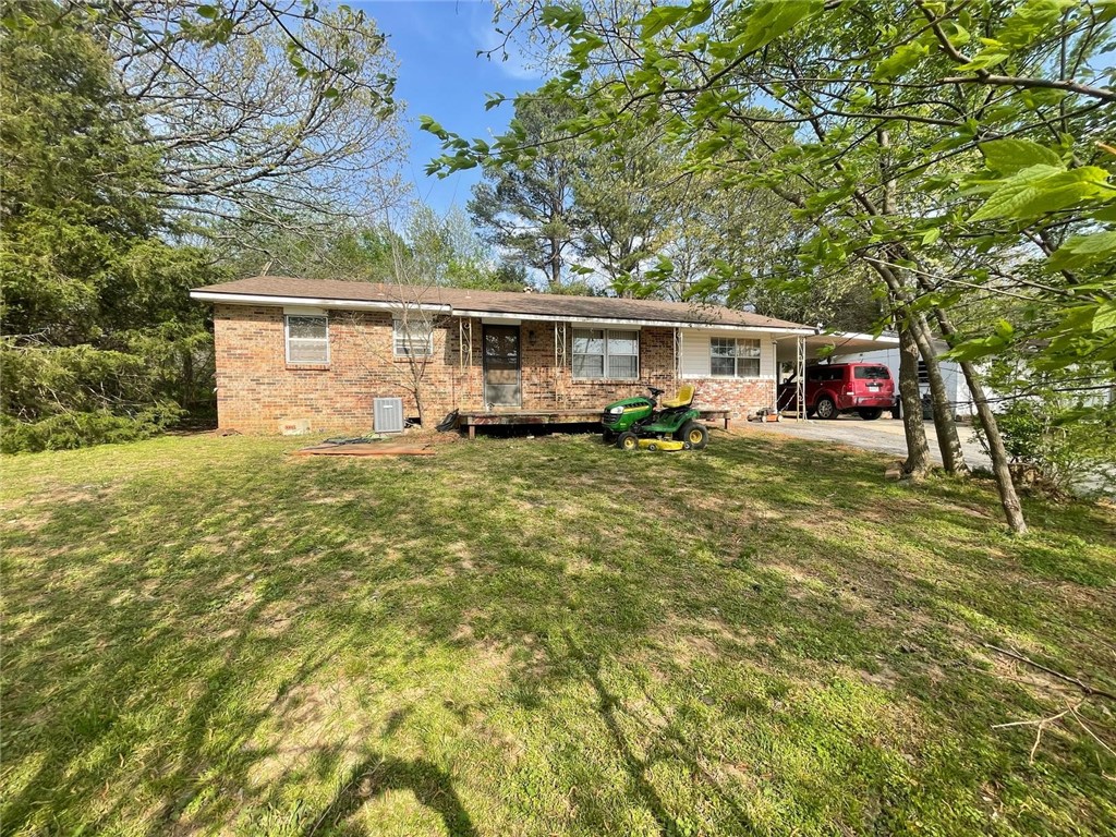 Charming home in Prairie Grove! Features hardwood floors (needs new carpet), central heat/air, and a 5-year-old roof. One bath has a beam needing replacement. No foundation issues. Original electric and plumbing.