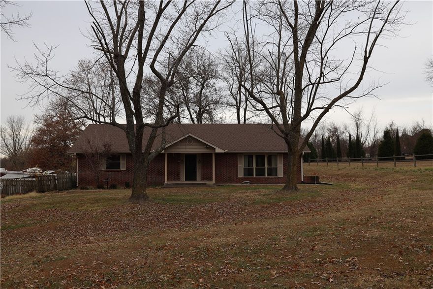 Beautiful very well built 3 bedroom 2 bath home. Large den, eat in kitchen, and large kitchen. Walk in closets in each bedroom. Office area downstairs off of garage. 30x30 detached shop building, 30x12 screened back porch. All on 5+ acres. Great for kids, animals, or possible development. New windows within last 10 years. Beautiful hardwood floors and carpet in bedrooms. A/C is five years old and water tank is 7 years old.