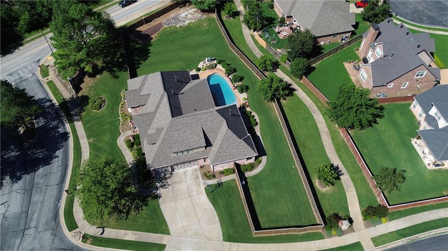 Luxury Living in Prime Bentonville Location!  Exceptional 4-bedroom, 4.5-bathroom custom home nestled on large lot. Beautiful curb appeal blending comfort, convenience, & high-end features living. Step inside to discover a thoughtfully designed layout. The kitchen is a chef’s dream ready for entertaining. Primary suite is a private oasis featuring a fireplace & spa-inspired bathroom w/heated floors. Dedicated kids’ wing provides 3 beds/2bath & separate heat/air systems. Experience movies on the 100in screen & surround sound. Throughout the home built-in speakers set the tone for any occasion. Step outside to a backyard paradise: heated pool, patio, fireplace, & cooking area w/grill & sink. Addt'l highlights: smartphone-controlled sprinkler tornado/safe room, office, craft room, formal dining, walk-in attic storage, and 3-car garage with built-in cubbies. This home offers the perfect blend of smart technology, luxurious finishes, & functionality-just minutes from top-rated schools, parks, & downtown Bentonville.