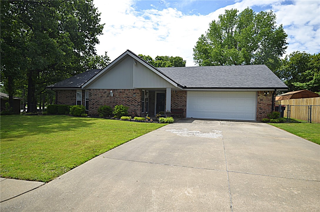 Don't miss out on this amazing opportunity to make this well maintained home yours. With easy access to I-49, this home is located on a quiet street in an established neighborhood. Large oak trees along the side provide shade in the hotter days that are just around the corner. The large LR features a wood burning fireplace with a gas starter with a beautiful brick surround. The kitchen area offers lots of cabinets with plenty of countertop space for all your cooking needs, plus a breakfast eating area with views of the back yard for that early morning meal with family. The dining area is conveniently located next to the kitchen with room for family and friends to enjoy an evening meal together. The outdoor patio is perfect for gathering with friends and neighbors for that BBQ dinner that everyone enjoys. Inside the fully fenced back yard is a large 10x12 storage building for all your lawncare equipment. The large back yard is the perfect area for the kids or your furry friends to run/play to their hearts content.
