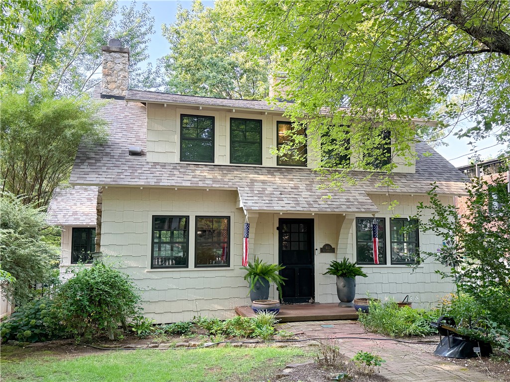 Your chance to own a piece of Fayetteville’s history has arrived. Step into timeless charm at 403 E Lafayette, a lovingly preserved historic home nestled in one of the city’s most sought-after neighborhoods. Every detail has been thoughtfully restored to honor the past while embracing modern comfort. The renovated kitchen, luxurious bathrooms, and all new windows blend classic style with fresh, high-end finishes, while the hardwood floors and restored fireplaces in the living room and upstairs bedroom, bring a warmth that only a historic home can. Outside, a white picket fence wraps the spacious corner lot in a picture-perfect frame, leading to a backyard oasis with flourishing gardens and a generous composite deck for evening gatherings with friends and neighbors. Fresh shaker-style siding adds crisp curb appeal, completing the perfect balance of history, beauty, and livability. Don’t miss this rare opportunity—homes of this caliber and character in this location seldom come available.