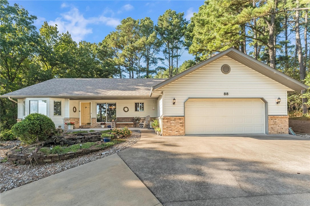 Enjoy year-round scenic views of beautiful Loch Lomond from this charming 2-bedroom, 2-bath home with office and sunroom in Bella Vista. The open Living Room welcomes you with a cathedral ceiling, hardwood flooring, and a cozy gas log fireplaceāperfect for relaxing or entertaining. The Sunroom offers a peaceful retreat to take in the changing scenery in every season. The spacious Kitchen and Dining areas flow effortlessly, creating a comfortable and inviting layout. The Primary Suite features a double vanity, whirlpool tub, and walk-in shower for a touch of luxury. With an additional office space ideal for work or hobbies, this home offers both functionality and style. There's even a heated and cooled lower level for a workshop, etc. The expanded 2 car garage has epoxy flooring! Conveniently located near Loch Lomondās marina, this property combines the tranquility of lake living with the comfort of modern amenities. Experience the perfect blend of natural beauty and everyday convenience!