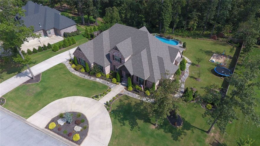 Unbelievable NEW Price!! Fantastic Executive Home w/Divine Heated Gunite Pool including Hot Tub&Tanning Pool.Home is located in a Cul-de-Sac on one of the Best and Private Lots in desired Versailles Sub (1.89Acres) w/Circular Driveway.Interior filled w/Natural Light from large windows to high ceilings to gleaming hardwoods.Open floor plan w/Formal Dining.Enjoy the view of the expansive outdoor living area through the double sliding glass door from the Living RM w/Gorgeous stone fireplace&beam ceiling.Designer white&bright gourmet Kitchen w/Walk-in Pantry.Dreamy Master Bdrm w/access to private office.Spa like Master Bath w/Rain Shower&Soaker Tub&Ahhh the Walk-in Closet completes this home.All Large 4 Bedrooms are Located on Main Level w/Split bedroom floor plan.Upstairs Multi-purpose Rm w/Full bath, Closet&Wet Bar.Special Surprise in the Laundry Rm!! Exterior offers Extensive Landscaping, Fruit Trees, Veg Garden featuring Flagstone Path all around the home to Covered Patio w/Fireplace.