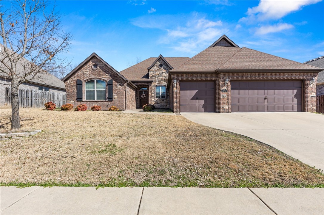 Welcome to this beautifully updated 4-bedroom, 2.5-bathroom home, ideally located just minutes from I49 and the vibrant city of Fayetteville. Offering the perfect blend of comfort and convenience, this home features fresh paint throughout and brand-new carpet, creating a clean and inviting atmosphere. The spacious, open-concept layout seamlessly connects the living, dining, and kitchen areas, making it perfect for entertaining or everyday family life. Step outside to the large covered patio and custom extended stone patio with jacuzzi wiring in place, ideal for enjoying the outdoors year-round. Located in the desirable Belclaire Estates, you can enjoy the neighborhood pool and playground all summer long! With its central location, this home offers easy access to shopping, dining, and all that NWA has to offer. Don't miss out on this fantastic opportunity!