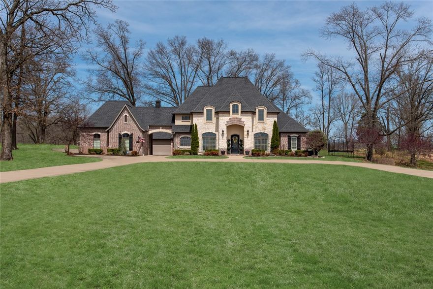 Gorgeous custom estate on private 1.41 acres featuring inground pool, full landscaping and elegant detailing. Impressive grid molding ceiling is highlighted by sunlight from two large floor to ceiling windows in living room. Built-ins and grand stone fireplace add charm to the space. Kichen's open concept allows for plenty of counter space and ample storage. Glossy cabinetry, backsplash and intricate details characterize this gourmet kitchen. Sizable master bedroom boasts a row of bay windows and a spa-like ensuite. Walk-in closet solves all storage solutions. Spacious bedrooms, bonus rooms and 4.5 bathrooms ensure plenty of options. This home is perfect for entertaining inside (with two dining spaces) or outdoors on the patio. Stunning square pool, basketball pad, circle drive, whole home generator and portico entrance to garage make this home one of a kind. Privacy is guaranteed as the property is surrounded by land.