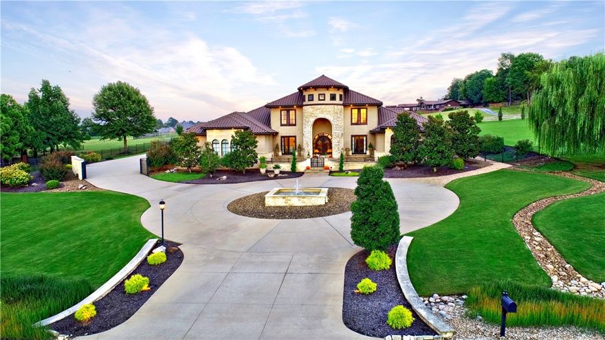 Spectacular home located on 3.8 AC in one of Fayetteville’s most desirable neighborhoods.  Updated 7200 SF estate home w/neutral paint & designer lighting.  Open floor plan is perfect for entertaining or everyday living.  Main floor features FDR, FLR, chef’s kitchen, den, bar w/conversation area, media room, game room, OFF, guest BR w/ensuite & primary BR w/2 large walk-in closets.  Upstairs has 2 BR, 2 BA & sitting area w/b-i bookcase.  Outdoor entertaining area w/beautiful saltwater pool w/sunbathing deck, b-i grill, refrig, covered porches, outdoor FP, ½ BA & adjacent 1200 SF guest house.  Guest house has LR, KIT, 2 BR & 2 BA. Total of 5-car garage & greenhouse.  Schedule your private tour of this home.