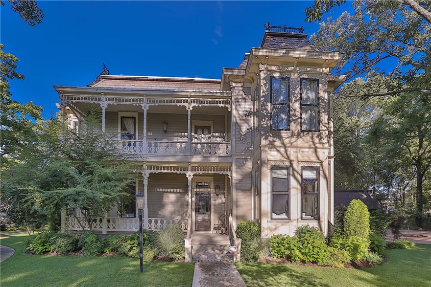 This exquisitely renovated Victorian home is a Downtown Bentonville landmark! Great efforts were taken to retain the historic charm of this 1891 built gem yet offer every modern comfort and amenity. The main home features 5 spacious Bedrooms, 3.5 Bath, 2 Living Areas, New Kitchen with top of the line appliances, extraordinary finish out, original wood floor, full home Theatre, Office, Mud Room, Formal & Casual Dining, Custom Cabinets, Wood burning Fireplace, Backyard Oasis, & Guest house w/full kitchen.