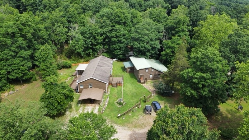 Discover a rare opportunity at your own private retreat just minutes from Fayetteville! Nestled on 61.18 acres of rolling countryside, this unique property features two homes and over 55 acres of fenced pasture, ideal for cattle, horses, or hay production. Enjoy peace, privacy, and panoramic views in a secluded setting that offers the perfect balance of rural living with modern convenience.
Both homes are thoughtfully positioned for privacy, and the property is equipped with solar panels, allowing for off-grid living and energy efficiency. With the potential to be fully self sustaining, this land offers endless possibilities- whether you're looking for a homestead, multi-generational living, or a working farm. This property has two separate houses and multiple out buildings on the property.