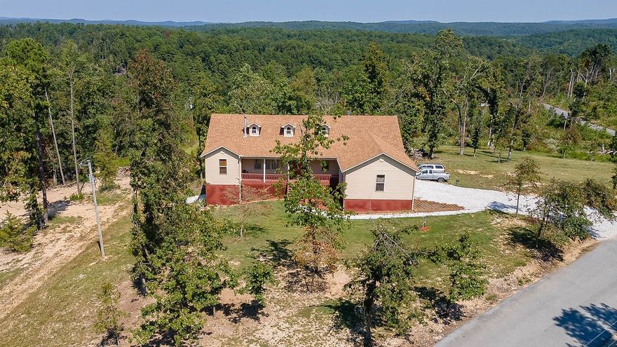 Traditional-style home on 2.27 acres offering space, comfort, and versatility. The main level features 3 bedrooms, 2.5 baths, an office, tall ceilings, and a dual fireplace shared by the living area and primary suite, plus a cozy woodstove in the living room. The kitchen offers ceiling-height cabinetry, and the screened-in sunporch provides additional relaxing space. The mostly finished basement includes 2 bedrooms, 1 bath, plus potential for 1,700+ sq ft of expansion and a large workshop with a garage door. New roof and upgraded HVAC with enhanced filtration in 2024. A 3-car garage, large storage shed, and pet fencing add convenience and functionality. Located next door to War Eagle Cavern and minutes from Beaver Lake with abundant fishing and recreation. Hobbs State Park and McIlroy Management Area nearby, easy access to Eureka Springs and Rogers. Airbnb potential with ADA accessibility on the main floor. The potential to add 1700 sqft in basement should be considered with this home. Partially completed already.