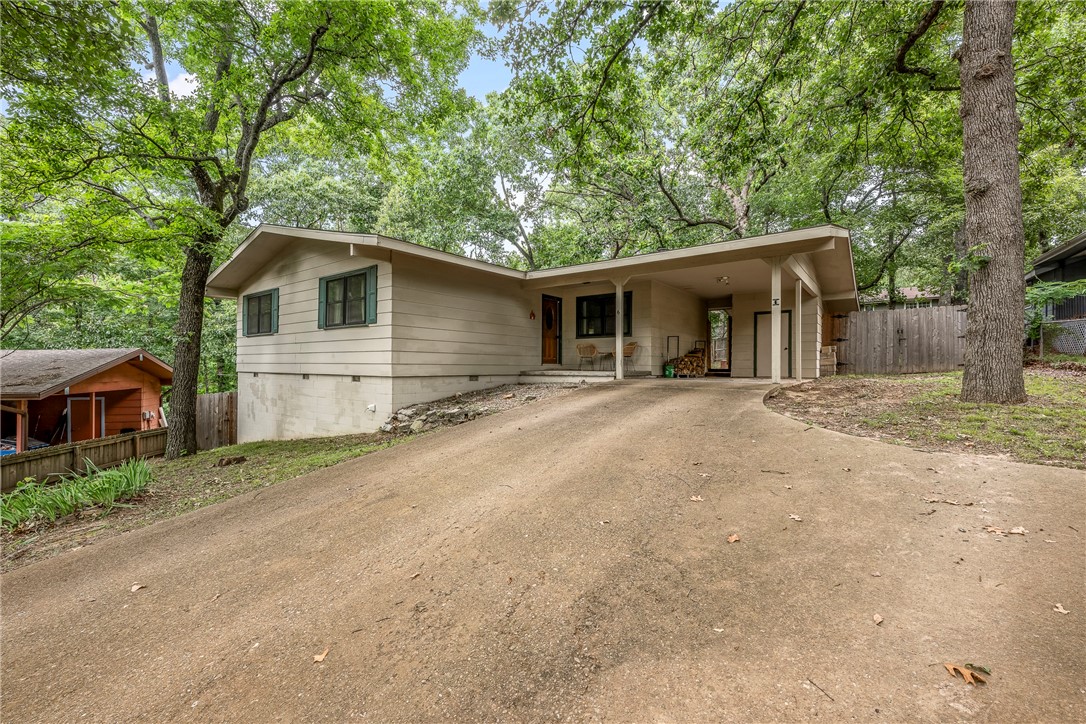 Built in 1972, this home features; 1244 square feet, 2 bedroom, 2 bathroom, Living Room, Eat-In and remodeled Kitchen, Living Room with wood burning stove, Screened in Porch, extra Storage off carport, second extra 7.2x11.7 attached storage (could be workshop area). New in 2025 Water Heater, 2023 flooring, 2023 paint, 2023 kitchen remodel, 2021 Windows, 2020 Fence, 2019 Roof. Propane tank owned. Easy access to Hwy 71 / I540 for easy daily commute.