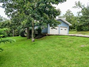 Looking for Privacy but close to town?Check this one out! Clean and comfortable remodeled 3 br/2 bath all electric home on .86 acres. This beautiful home is surrounded by trees is conveniently located just minutes from town. Spacious living room/dining room with new laminate flooring and stained wood ceiling. All of the bedrooms are large with walk-in closets, shelves, new carpet and ceiling fans in every room.Master bedroom has private bathroom and features heated floor and rainfall shower. Remodeled over last 2 years includes new pex water lines, new electrical, new kitchen counter tops,automatic pantry lights, NEW 26 gauge standing seam roof, full front porch deck, back deck and oversized garage.