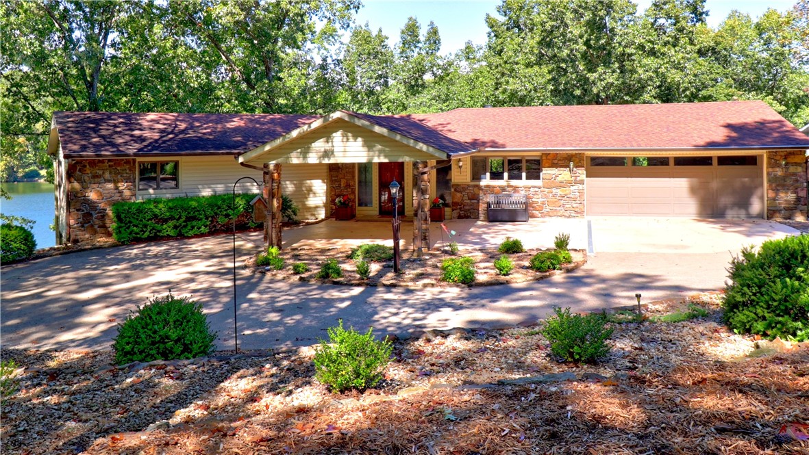 Unique Architecturally designed open floor plan provides beautiful year round Lake Windsor views. Walkout to Covered deck and wrap around of low maintenance Trex, Concrete sea wall/walkway, channeled drainage system to concrete spillway, poured concrete basement, Gentle walk to large dock with electric & expandable boat slot, Kitchen is a chef's dream, center island Jennaire glass cooktop, double wall ovens, French door fridge, pantry, abundant storage & workspace with adjoining breakfast room. Wet bar/fridge adjoins Living room with gas log fireplace. Woodburning fireplace in Family room, walkout to covered lower level patio, cedar closet, 2nd BR has 3 closets, 3rd BR hosts a balcony. 2 baths on lower level, Tons of storage throughout, large workshop + work shop in garage. Main floor Heated/cooled seperate laundry. 2 car garage + 2 car port at front entry with circle drive. A must see to appreciate all the amenities.