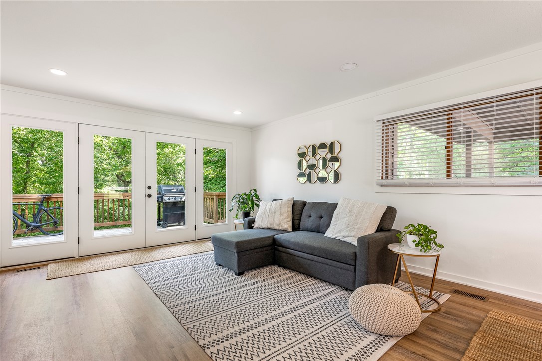 Welcome to your stunningly renovated 1872SF gem! Boasts modern touches throughout. Enjoy fully updated kitchen featuring stainless appliances, updated cabinetry, bathrooms, flooring, newer AC, plumbing & electrical system. Expansive upper deck; ideal for hosting gatherings, offering a tranquil view of the surrounding woods. With two living areas and bonus downstairs this home is ideal for Airbnb. Furnishing are negotiable. Spacious bedrooms provide ample space. Designed w/energy efficiency in mind, the house includes a tankless water heater, newer HVAC, electrical wiring, digital lighting, plumbing & Nest thermostat, connected to BV sewer. Join this golf community w/access to 3 fitness centers, tennis courts & pools. Delight in the forested landscape, surprising bluffs, creeks & waterfalls. Thickly wooded & serenely natural, enjoy a day fishing & fun on 7 lakes, run along trails, or a thrilling ride on your mtn bike.