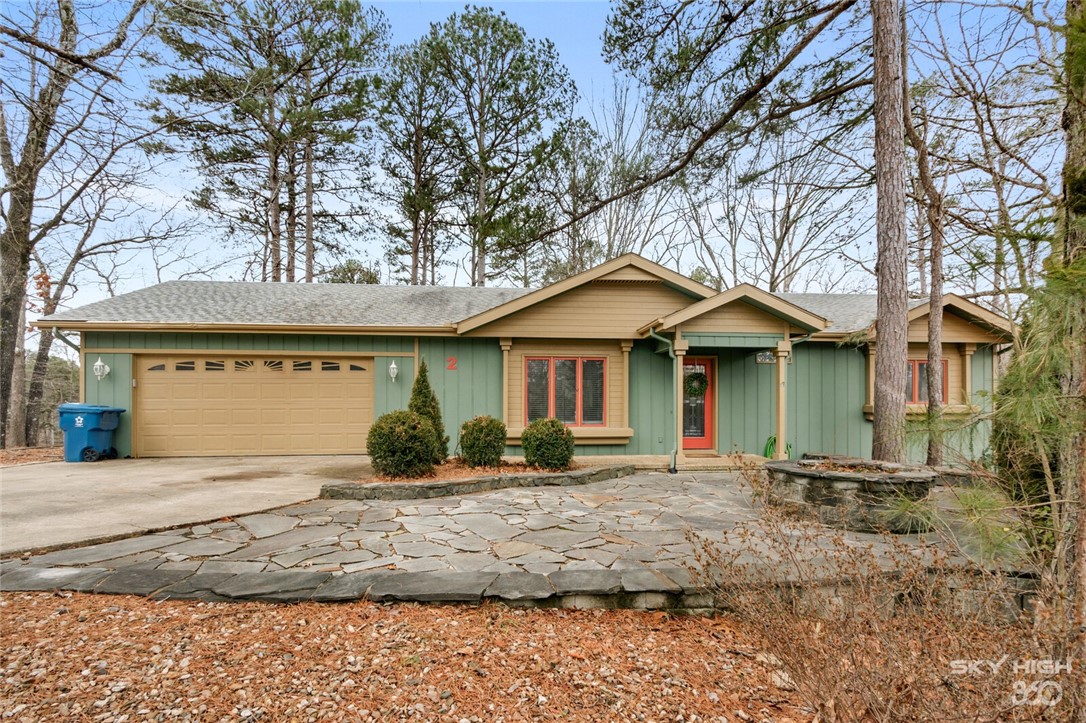 Are you ready to see one of the most charming homes in Bella Vista? This is your chance to own two lots in Bella Vista. This 2 Bedroom/2 Bath home sits on one lot and the lot right next to it gives additional privacy and space. This is the setup you have been waiting for. Approaching the front door you will see flat stone landscaping and evergreens leading to the front door. As you walk in, you are greeted with a cozy living room right next to the dining room and kitchen. Enjoy your coffee or watch the deer from the sunroom or on the deck. Down the hall you have the hall bathroom and both bedrooms. Check out the updated master bathroom. Being only 1.5 miles from the exit, the convenient location makes this a wonderful short term rental or a wonderful location for your family. Enjoy the trails, lakes, and golf courses of Bella Vista while being a short drive to Bentonville. Age of roof and Hvac are unknown. Showings start Friday at 4:00pm.