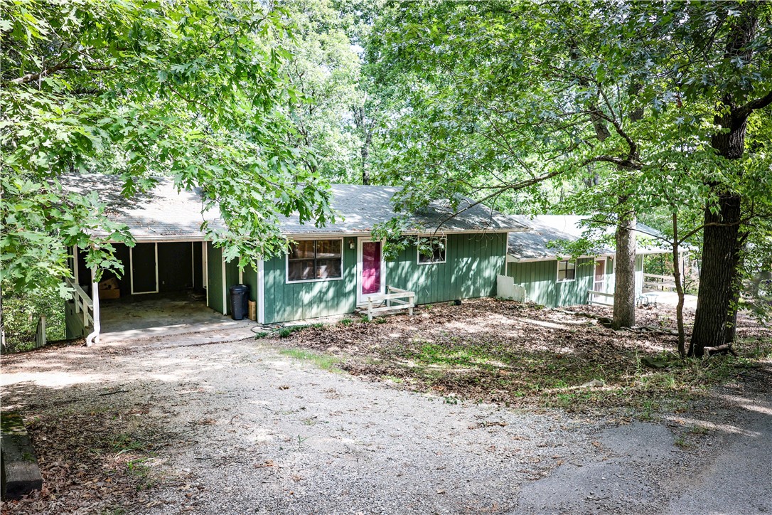 Well established income producing 2 unit duplex located on 1.5 acres on the peaceful and serene More Mountain. Each unit features 952 square feet with 2 bedrooms and 2 bathrooms, galley kitchen, spacious layout, woodburning fireplace in the living room, an enclosed sunroom to enjoy the beautiful nature view in the back, central H/A, carports.