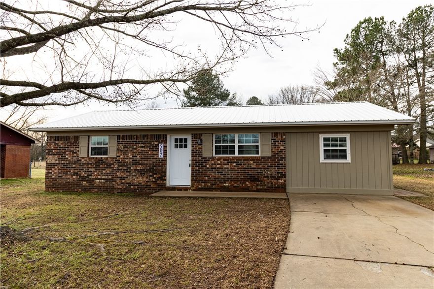 Completely remodeled and move-in ready, this Ozark home offers a rare opportunity to own an updated property under $130K. Major exterior upgrades include a durable metal roof and updated vinyl windows. Inside, you’ll find fresh paint, luxury vinyl plank flooring, updated lighting, and a bright open living and kitchen layout designed for comfortable everyday living. The kitchen features new cabinetry, stainless steel appliances, and generous counter space. A split floor plan provides added privacy, with a spacious primary bedroom offering exterior access to a private side patio. Two additional bedrooms allow flexibility for guests, family, or a home office. Additional improvements include a new water heater, updated fixtures, a modernized bathroom, and new flooring throughout. Conveniently located near schools, shopping, and local amenities. At $129,900, updated homes like this are hard to find in Ozark.