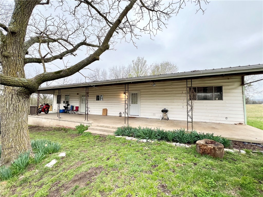 Quaint county setting, easily accessible to all things NWA. Great opportunity for family to live side by side, or as an investment for you to live in one side & rent out the other! 2bed/1bath per unit. Remodeled in 2008, including new plumbing & electric. Updates to roof in 2020. Water heaters less than 5yrs old. Brand new side deck. All appliances, including refrigerators convey. Expansive covered porch, perfect for summer & enjoying the beautiful pasture views. Situated right off Hwy 59, a mere .5mi from the Historic Sulphur Springs City Park, La Balladine Lake, & Butler Creek. Only 5mi to Gravette & Noel, MO, 11mi to I-49, & 20mi to Bentonville, Centerton & Bella Vista. City utilities. Sale subject to a lot split, acreage is estimate. Seller prefers Owner Finance, with proof of income. Tenant occupied - do not disturb! Also listed as a group w/ cabin next door (440 N Duff Ave), see ML#1275214. Cabin listed individually as well, ML#1275062