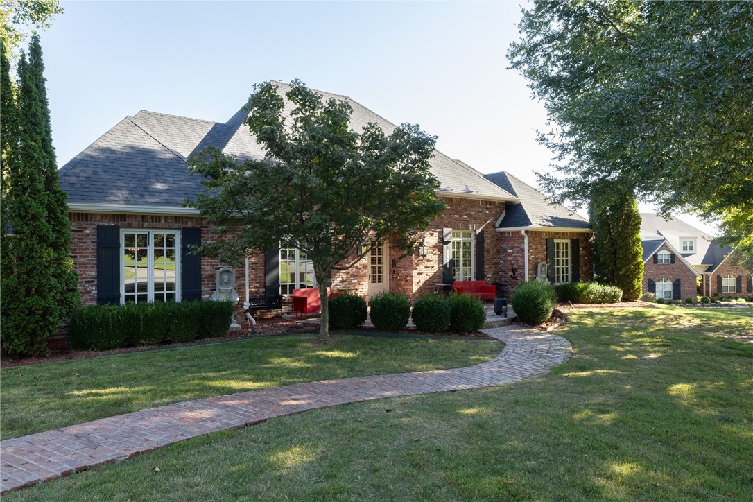Elegant one-owner home on 1.77 acres in the desirable Ridgemont View Estates! This thoughtfully designed residence features 3 bedrooms, 3.5 baths, & a 5-car garage. Rich maple hardwood floors flow through the main living areas, including the formal living & dining rooms, family room, & ownerās suite. The kitchen is beautifully appointed with granite countertops, a spacious island, & a 5-star range with six burners, a griddle, & double ovens. A bright, inviting sunroom serves as the heart of the home, opening to a beautifully landscaped courtyard complete with a tranquil fountain, brick walls, & wrought-iron gatesācreating a private outdoor retreat perfect for quiet mornings or evening gatherings. The ownerās suite offers its own covered patio with peaceful views of the courtyard, while professional landscaping enhances the homeās refined curb appeal. One garage includes two built-in dog kennels, adding a thoughtful touch for pet lovers. Every detail of this property reflects care, comfort, & enduring craftsmanship.