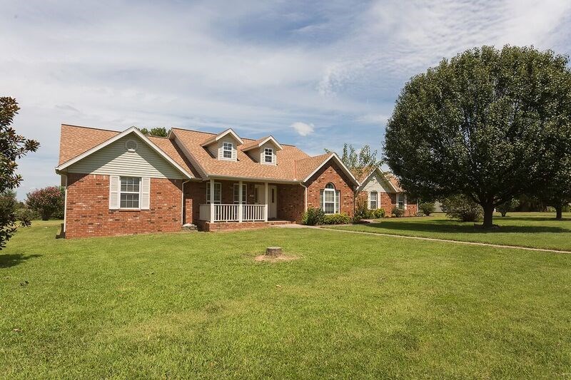 CHARMING HOME ON .63 ACRES WITH 4 CAR TANDEM GARAGE + WORKSHOP! Homes sought after features include 3BD/2BA, sunroom, formal dining, large kitchen with island, eat-in kitchen, vaulted ceiling in living room with fireplace, large master bedroom with tray ceiling, double vanity, storm shelter, and covered patio to relax and enjoy your oversized backyard. New carpet and paint. CALL TODAY FOR YOUR PRIVATE SHOWING!