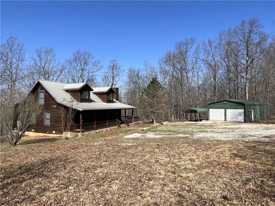 Secluded 3BR-2BA rustic Ozark Mountain log cabin on 15.93 acres m/l!! This 1,504 SF home was built in 2004 from 8 inch cypress logs with dovetailed corners and features a native stone wood-burning fireplace, loft, cathedral ceiling, under-the-stairs pantry, 2 large covered porches, and metal roof. This property also features a 20x30 metal shop building with concrete floor and electric plus a one car carport. The land has gentle rolling topography and approximately 6 cleared acres with fencing, a stocked pond, and a healthy variety of native trees including redbuds, dogwoods, and persimmons. Great hunting environment! Home sits off the dead-end road and is only 10 minutes from the Buffalo National River Park and the Steel Creek access point. Call today to schedule a showing!