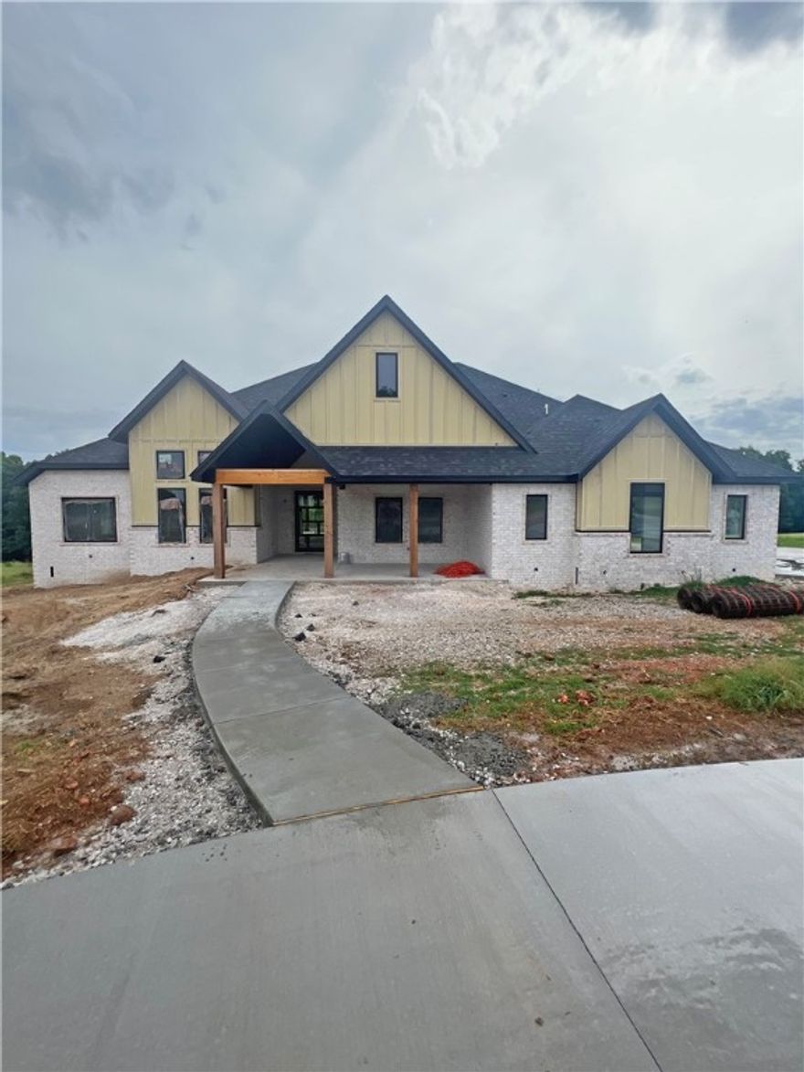 New estate home located on 1.78 acres in new upscale neighborhood. This home features 5 Beds, 4 Baths, Office, Dining, Butler Pantry and Theater Room.  Professional series appliances including double oven, double refrigerator/freezer, and wine fridge. Kitchen has upgraded floor to ceiling cabinets with lots of extra cabinet space and quartz countertops. 42” Artisan fireplace in living room with high vaulted ceiling and 4 section glass doors. Master suite features wood floors, tile to ceiling around free standing soaker tub, double shower heads with rain head. Very large wrap around master closet with built in dresser. Laundry room has sink, large mud bench, folding table, and double drying racks.  Theater room has full wet bar, beverage fridge and is wired for sound and projector.  Energy efficient with 3 HVAC units, low E black windows, tankless water heater and is wired for backup generator. Oversized 3 car garage with circle driveway. Large covered back patio with outdoor fireplace and large vaulted front porch.