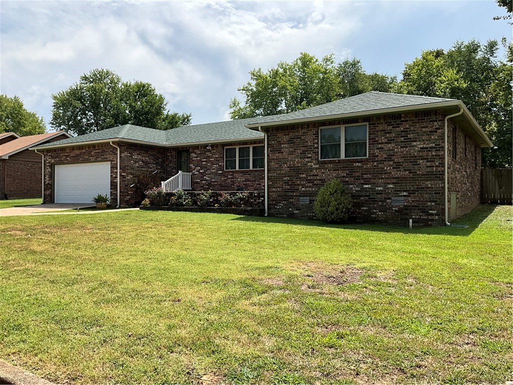 Beautiful brick home in the Heart of Berryville! This charming, meticulously maintained 3 bedroom home is snuggled into a cozy, manicured neighborhood with centralized access to all of Berryville. Whether it be the Historic City Square, Carroll Country Club & Golf, Shopping (major new retailer announced for 2025) or the Outdoor Recreation for which the Ozarks are most famous (by way of the robust Kings River), its all within a 2 mile radius! Berryville is a lovely and charming community known for its traditional, resourceful and friendly culture. And hey, if you want to keep it weird for a weekend.. Eureka Springs is less than 15 minutes away! This home has a new roof, new AC unit, new windows throughout! Front foyer and Parlor room, open Kitchen which looks into the Living Room with a custom, brick Fireplace. Double doors leading to a fresh back porch, a huge backyard and a shingled-roof shed for storage, hobbies or kids' clubhouse! Open House on Sunday 8/30! Neighborhood even has buried power lines!