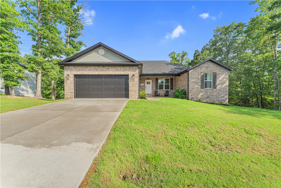 In Bella Vista & BHS district, this better-than-new home offers charm, comfort, & investment potential. Features include 2 bedrooms, a flex room w/ closet, 2 baths, & an open layout perfect for relaxing or entertaining. The extended deck overlooks wooded views, w/ updated landscaping, covered front patio with level front yard, & a hot tub that conveys. Kitchen includes granite counters, SS appliances, & the fridge stays! Minutes to Lake Brittany, plus nearby shopping & dining. Seller's are offering a generous $2,500 toward buyer concessions & this home is USDA-eligible financing. Bella Vista offers lakes, golf, top amenities, parks, & right from your front doorsteps you will enjoy convenient access to some of the best sections of the Back 40 trail network (Taylor Homestead, Ledges, SBAT, Flo Ride, Pinion Creek trails), part of the 'Mountain Biking Capital of the World.' Perfect as a forever home or short-term rental.