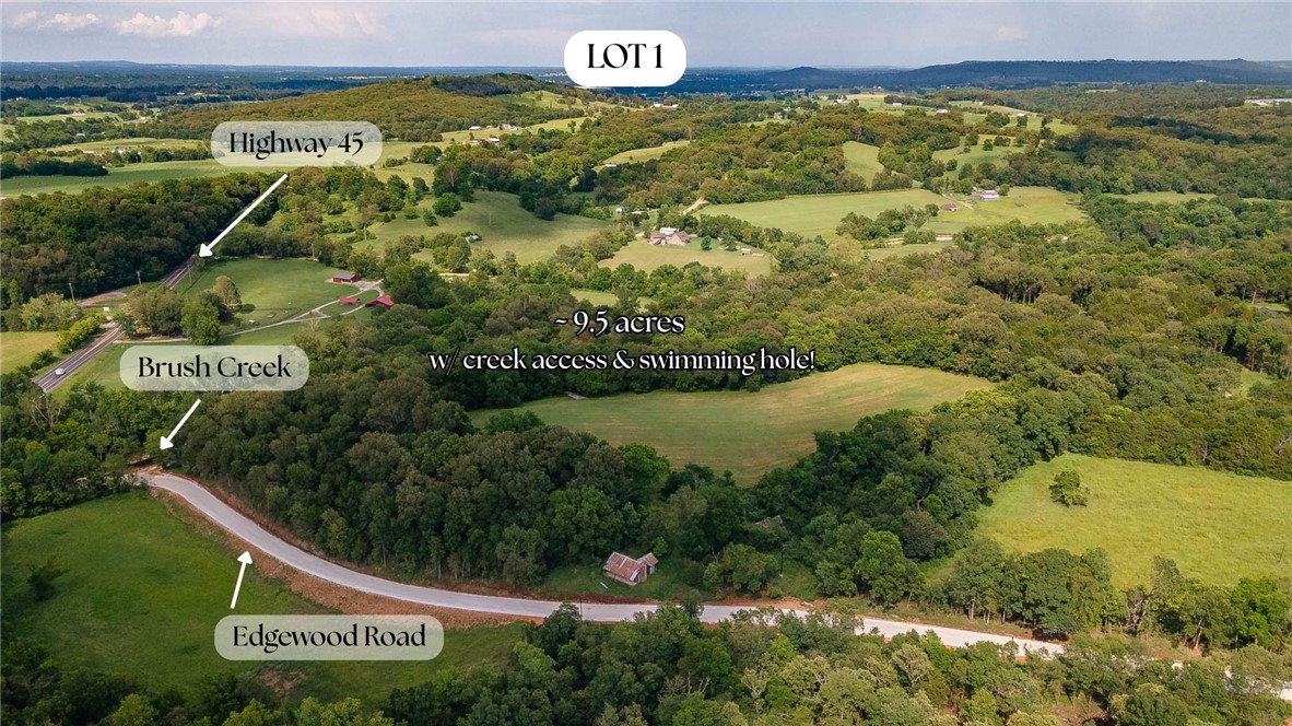 Incredible opportunity to own an estate style lot 15 minutes from the intersection of Crossover and Mission in East Fayetteville. Rolling hills, a private drive, mature trees, and creek access situated on a 9.5 acre lot. Utilities are available at the street. This is the perfect building site for an executive style home! Property is zoned for Fayetteville Schools.