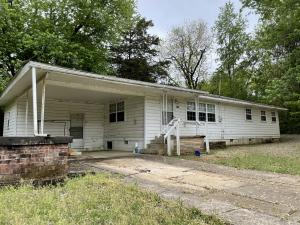 3 bed 1.5 bath home in Coal hill. Potential 4th bedroom. Lots of opportunity, investment property. Large square footage at 1568 square feet with spacious living, dining, and kitchen areas. One car carport, storm shelter, and close to downtown Coal Hill. surrounded by trees, large backyard .Sales as is with no repairs by seller, no termite contract, no disclosure, sale will have to be court approved