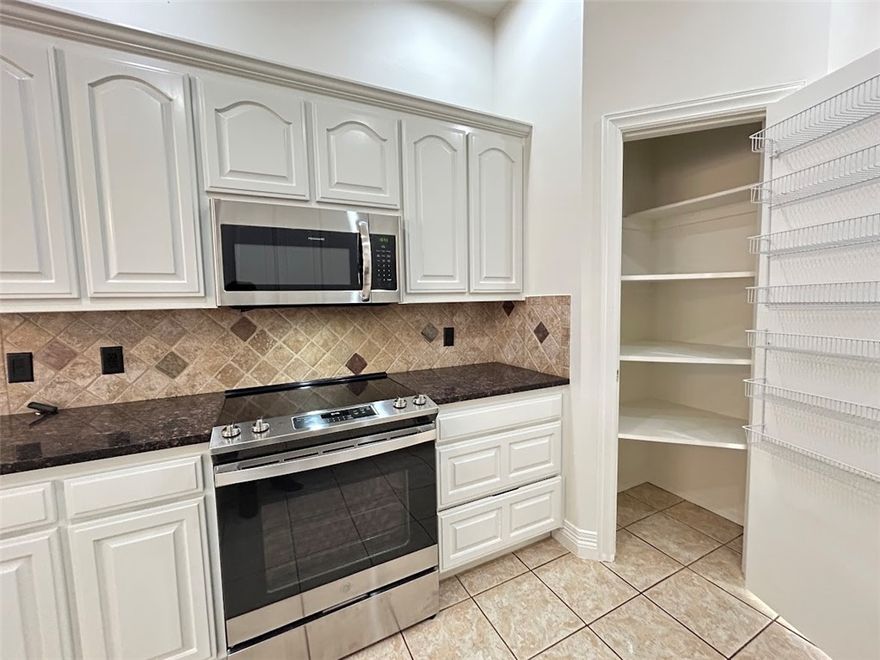 Elegant 4-bedroom, 3-bath residence in the sought-after College Place community of Bentonville, now available for rent. This beautiful home features fresh paint throughout & a thoughtfully designed floor plan ideal for both every day living & entertaining. Enjoy a formal dining room, private den/study or game room, eat-in kitchen complemented by hardwood & tile flooring, w/plush carpet in bedrooms. Primary suite offers a spa-inspired bath w/ double-sink vanity, soaking tub &  walk-in shower. The gourmet kitchen showcases stainless steel appliances, granite countertops & white cabinetry. A sun-filled sunroom opens to a spacious deck overlooking the fully fenced backyard. Two-car garage.