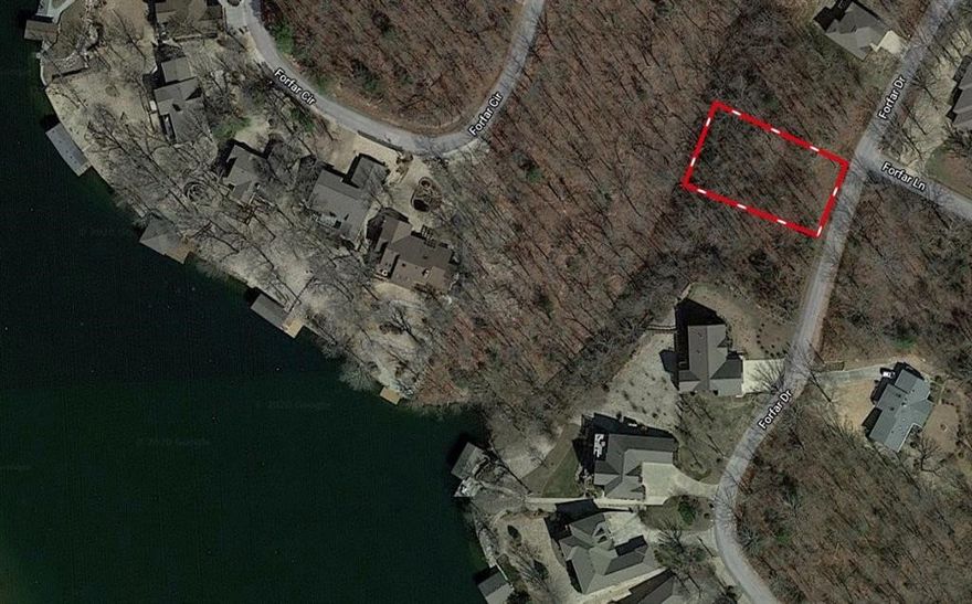Scenic lot in Bella Vista with a beautiful lake view of Loch Lomond. Enjoy the best of Bella Vista Village living with access to top-tier amenities, including championship golf courses, miles of walking and biking trails, tennis courts, indoor exercise facilities, and more. Located close to the Boat Launch, this property is perfect for those who love lake life, recreation, and the outdoors. Take a walk behind your home to put in your kayak. A great opportunity to build your dream home or investment property in a highly desirable community.