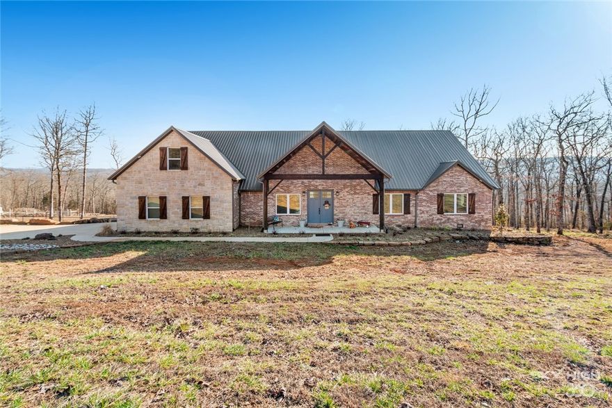 You will love this stunning custom built home that sits on 34 acres. Low maintenance brick and stone exterior giving it a stylish appearance. This well thought out home has 25 seer high eff. HVAC system ,4 zone HVAC, whole house dehumidifier, instant hot water, foam insulation w/2x6 ex. walls,work space in crawler w/concrete pad, security system&central vac. Wood burning stove. Massive island, apron sink w/a view, apron prep sink, quartz counters&brick backsplash. Walk-in pantry, you will just love all of the deep drawers in kitchen. Pot filler, instant hot water, trash compactor, glass front upper cabinets. Enjoy the breakfast bay with a view! Master suite has custom shower with dual heads, slipper tub, & double sinks, plus a huge walk-in closet. 1 bed has private bath,2 are connected with a Jack/Jill bath. Bed 5 is upstairs with it’s own bath.  Back entry has mudroom, laundry room & extra room. Large covered porch wired for tv and surround sound. Pad built for up to a 60x80 shop.Water&sewer hookups.