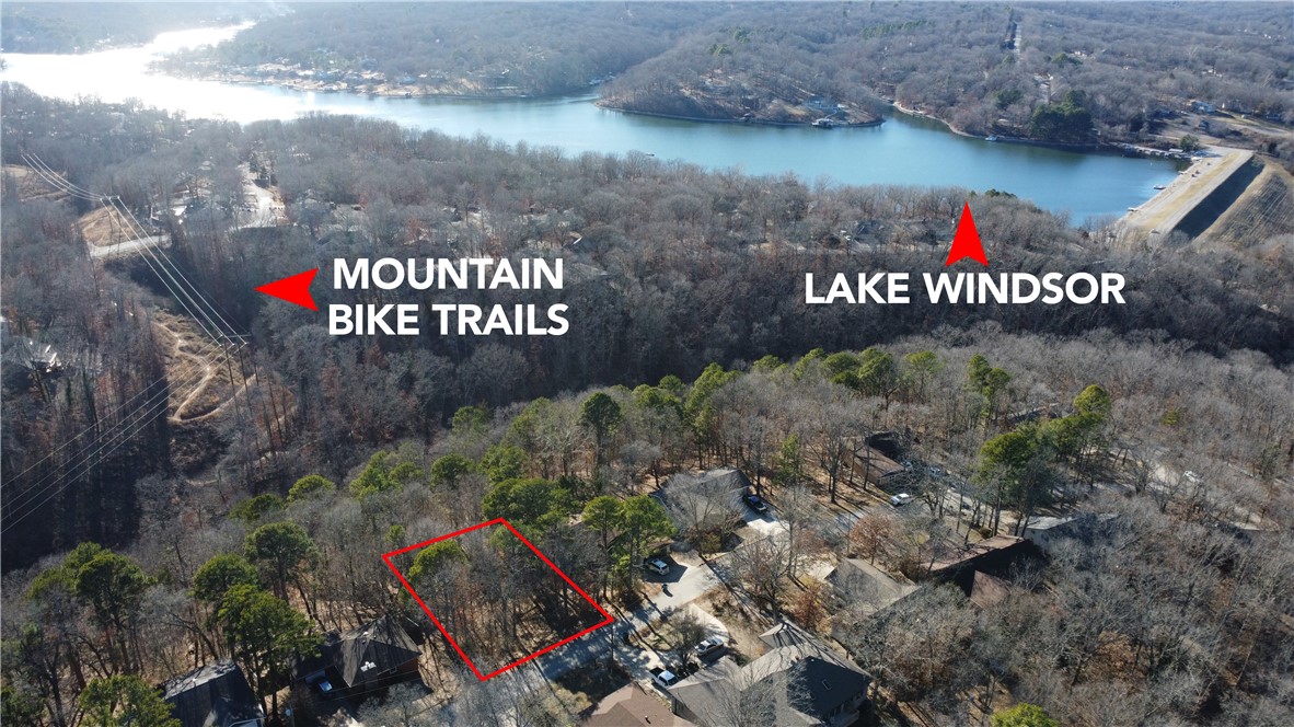 Get on Tunnel Vision Mountain Bike Trail from you backyard! Boat, Fish, Mountain Bike, and Golf all in the same day. Build your dream home on this Bella Vista lot that sits just west of Hwy 71B off of Chelsea Rd. Lot is right next door to Lake Windsor and Bella Vista Country Club Golf Course and Tanyard Creek. Bella Vista POA includes: 108 holes of golf spread among seven golf courses, a golf range/practice center, seven private lakes, swimming pools, tennis, pickleball and basketball courts, miniature golf and playgrounds, walking trails, a gun range, an RV park and campground, and fitness and recreation centers.
