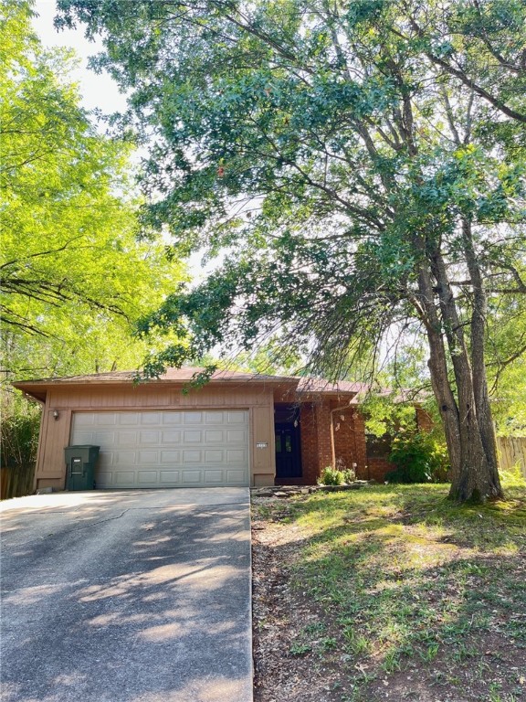 Welcome to this stunning 3-bedroom, 2-bathroom home located in the vibrant city of Fayetteville, AR. This property boasts a large master suite with a double vanity, offering ample space for your comfort and convenience. The spacious eat-in kitchen, complete with all necessary appliances, features a breakfast bar and a tiled chef's kitchen, perfect for those who love to cook. The home also includes LVP flooring throughout, adding a touch of elegance and durability. The living room is highlighted by a huge brick fireplace and recessed lighting, creating a warm and inviting atmosphere. Step outside to a covered back porch overlooking an extra-large lot, providing plenty of outdoor space for your enjoyment. This home is a perfect blend of style, comfort, and functionality. Don't miss out on this incredible opportunity!